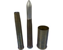 Three brass ammunition casings.