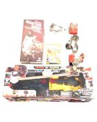 A remote controlled model car set together with a pair of vintage roller skates and Deluxe
