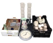 Two crates containing ceramic bowls, a wall clock, a metal jug, a pair of glass vases etc.