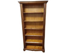 A pine open bookcase.