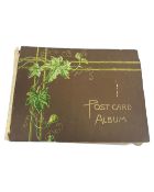An antique postcard album containing postcards of military interest, First World War etc.