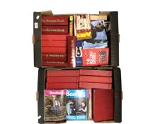 Two boxes containing Beatles monthly magazines and music related books.