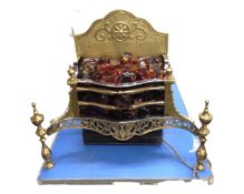 A brass electric fire with glass coals.