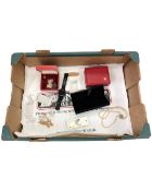 A box containing Garmin watch, costume jewellery, St Christopher pendant,