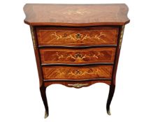 A French kingwood veneered three drawer chest.