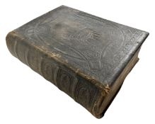 A 19th century family devotional bible by the Reverend Matthew Henry.