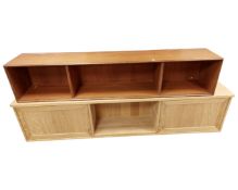 A Scandinavian teak wall shelf (length 169cm), together with a further oak effect wall shelf.