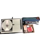 A boxed Czechoslovakian photographic enlarger together with a Cobra Profile camera tripod together