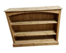 A pine open bookshelf.