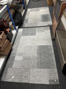 Two contemporary rugs on grey ground, 186cm by 120cm.