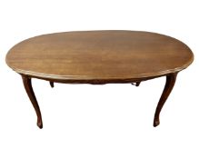 A reproduction French style oval coffee table.