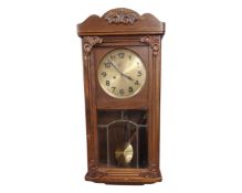 An oak Jungans wall clock.