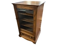 An Ercol elm and beech Canterbury audio cabinet.