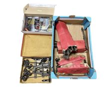 A box containing a quantity of Hornby O gauge track and a quantity of classic bus magazines.