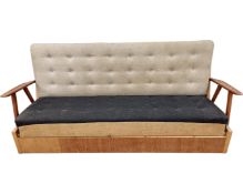 A Scandinavian teak framed bed settee.
