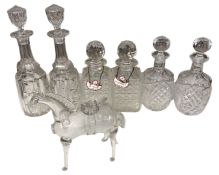 A tray containing three pairs of crystal decanters and a glass wine jug in the form of a horse.