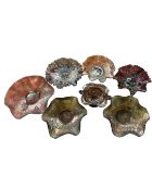 Seven pieces of petrol glass.