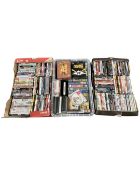 Three boxes containing DVDs, box sets and VHS tapes.