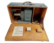 A boxed 35mm projector.