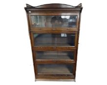 A Lebus four height oak stacking bookcase.