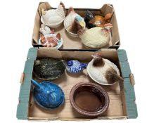Two boxes containing a quantity of ceramic chicken and duck dishes.