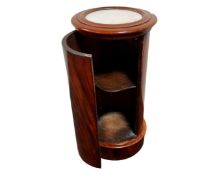 A Victorian marble inset cylindrical pot cupboard.