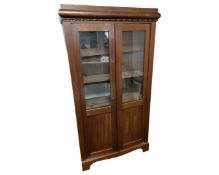 A 19th century continental mahogany double door bookcase.