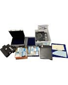 Two boxes containing a quantity of coin collecting boxes, coin capsules etc.