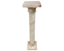 An onyx jardiniere stand.