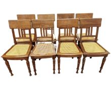 A set of eight oak dining chairs with bergere seats.