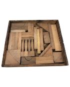 A vintage wooden construction set in tray