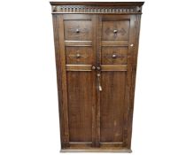 An early 20th century oak double door wardrobe.