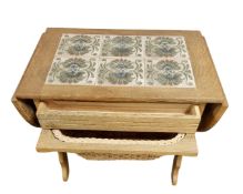 A Continental blond oak drop leaf table fitted with drawer and basket beneath.