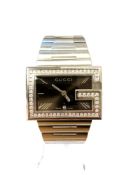 A Gentleman's Gucci wristwatch set with diamonds, the 58 diamonds approximately 1.4ct.