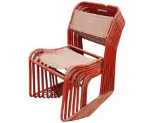 A set of eight stacking metal chairs.