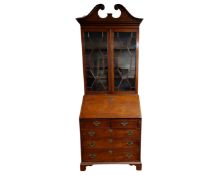 An Edwardian mahogany bureau bookcase.