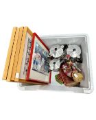 A box containing three stainless steel kettles,