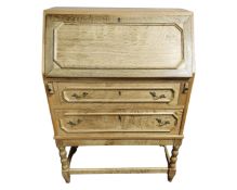 A Continental blond oak bureau.