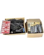 Two boxes containing model railway track and further modelling materials.