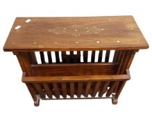 A brass inlaid hardwood magazine rack.
