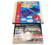A Technic Intercity series 4 part train set together with a boxed Chad Valley table tennis game.