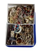 Two boxes containing a quantity of assorted costume jewellery.
