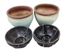 A pair of glazed ceramic garden planters together with four plastic hanging baskets