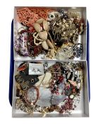 Two boxes containing a quantity of assorted costume jewellery.