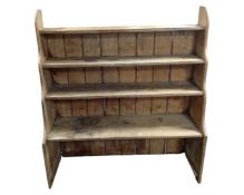 A set of antique pine waterfall bookshelves