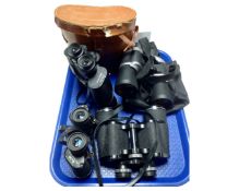 A tray containing four sets of field glasses including Halina, Hanimex etc.