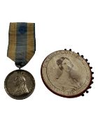 An official 1897 Diamond Jubilee Medal on blue and yellow ribbon together with an 1897 Jubilee