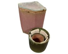 A set of three graduated glazed pottery planters together with a 20th century Lloyd Loom linen