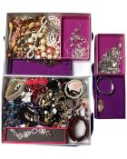 Two boxes containing a large quantity of assorted costume jewellery.