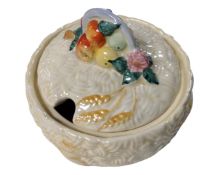 A Clarice Cliff Newport pottery lidded preserve dish.